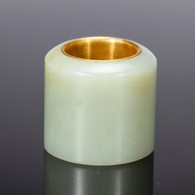 A WHITE JADE ARCHER RING