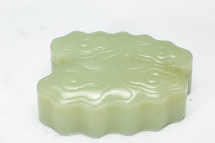 A CARVED JADE BOX WITH COVER