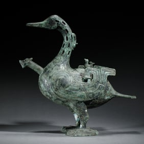 A RARE ARCHAISTIC BRONZE DUCK FORM VESSEL
