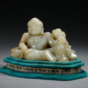 A CARVED JADE LUOHAN