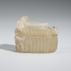 A CARVED WHITE JADE WASHER