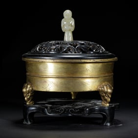 A BRONZE-GILT TRIPOD CENSER WITH COVER