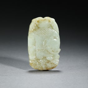 A CARVED WHITE JADE ELEPHANT PLAQUE