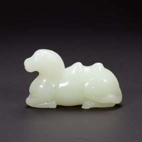 A CARVED WHITE JADE CAMEL