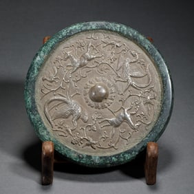 A BRONZE MYTHICAL BEAST MIRROR