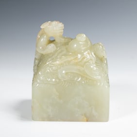 A CARVED WHITE JADE CHILONG SEAL