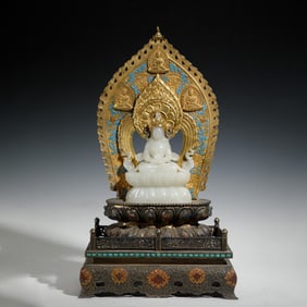 A CARVED WHITE JADE SEATED AMITAYUS