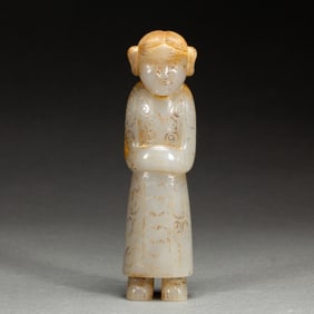 A CARVED JADE FIGURE
