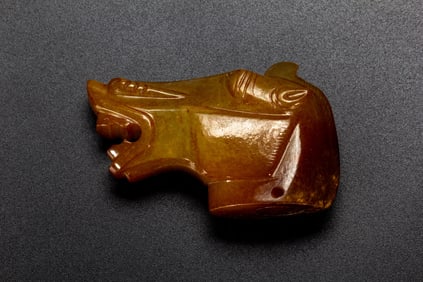 A CARVED JADE HORSE HEAD