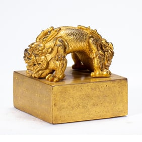 A TIBETAN BRONZE-GILT DRAGON SEAL