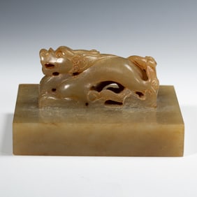 A CARVED JADE DRAGON SEAL