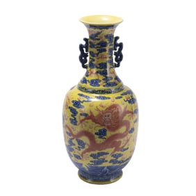 A CHINESE YELLOW GROUND UNDERGLAZE BLUE AND IRON RED VASE