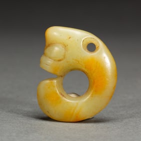 A CARVED JADE PIG-DRAGON