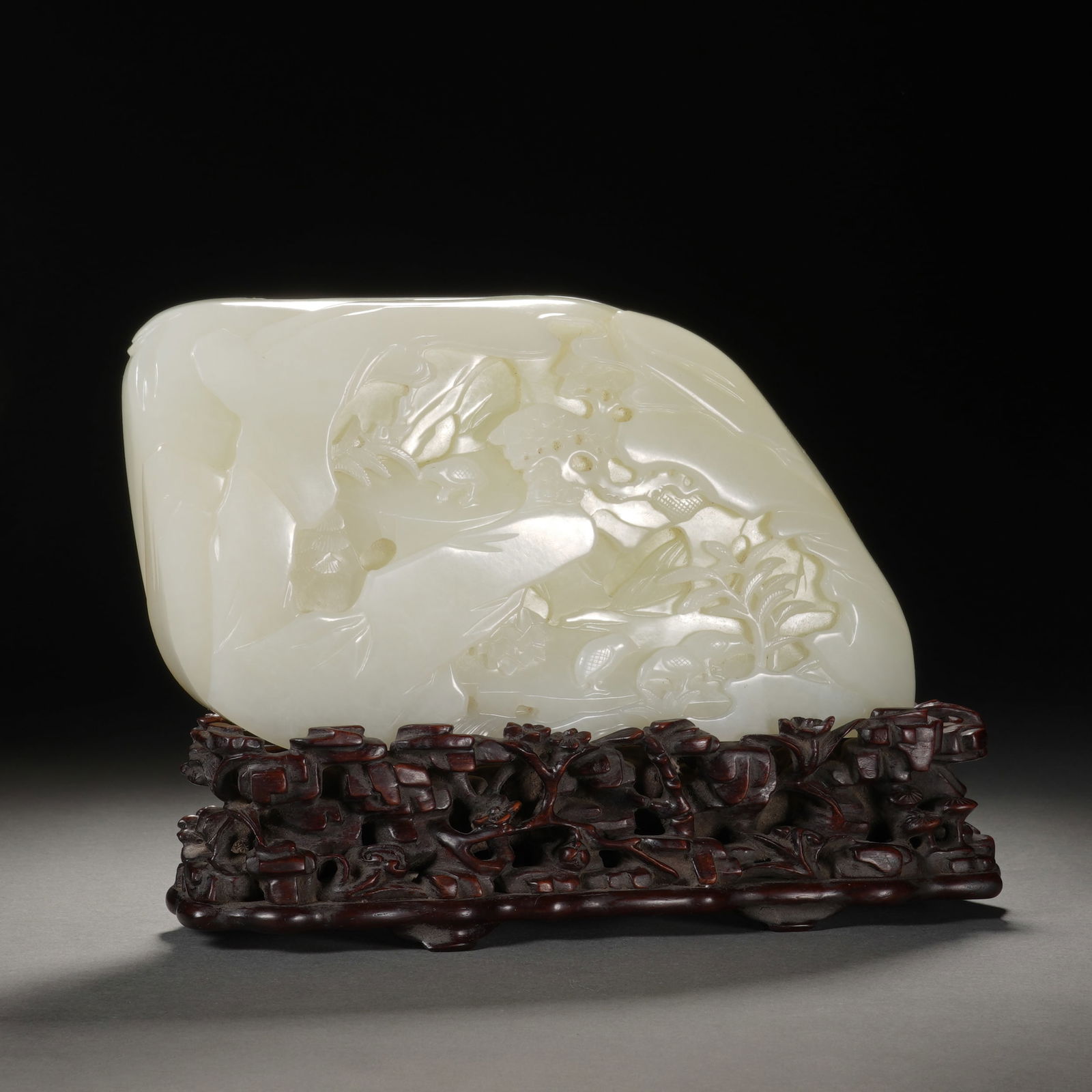 A FINE CARVED WHITE JADE BOULDER