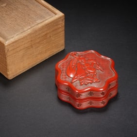 A CARVED CINNABAR LACQUER BUDAI BOX WITH COVER