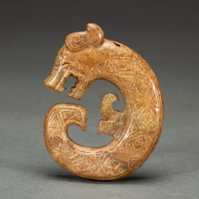 AN ARCHAISTIC JADE CARVING OF DRAGON