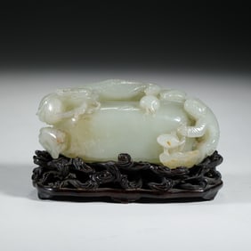 A CARVED WHITE JADE CHILONG WATERPOT