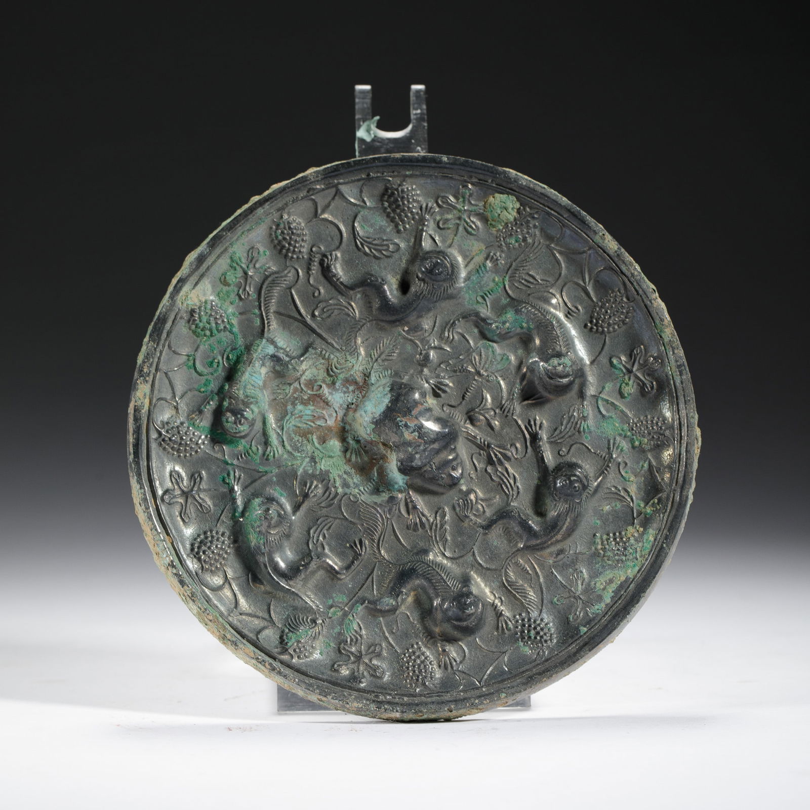 A BRONZE CIRCULAR MIRROR (1 of 9)