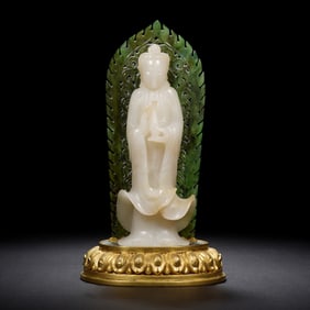 A FINE CARVED WHITE JADE GUANYIN WITH NUMBUS