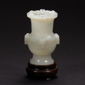 A CARVED WHITE JADE ZUN VASE