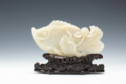A CARVED WHITE JADE FISH