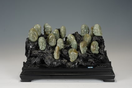A RARE SET OF EIGHTEEN CARVED JADE BOULDERS