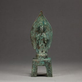 A BRONZE STANDING BUDDHA