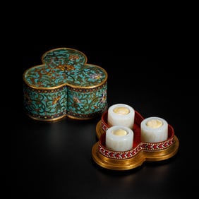 A SET OF THREE INCISED WHITE JADE ARCHER RING