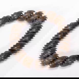 A RARE ALOESWOOD CHENXIANG PRAYER BEADS SHOUCHUAN: A RARE ALOESWOOD CHENXIANG PRAYER BEADS SHOUCHUAN Aloeswood, or chengxiamu or eaglewood, diffuses a fragrance which has made it highly treasured, especially in China, Japan and Tibet. The wood is typi