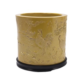 A YELLOW GLAZED CARVED PORCELAIN BRUSH POT