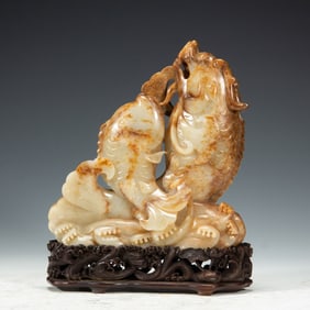 A CARVED JADE FISH-DRAGON DECORATION