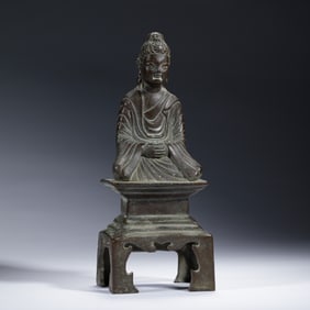 A BRONZE SEATED BUDDHA