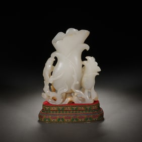 A CARVED WHITE JADE MAGNOLIA VASE