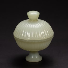 A CARVED WHITE JADE VESSEL WITH COVER