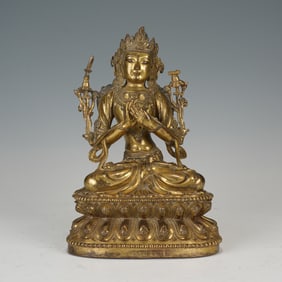A SINO-TIBETAN BRONZE-GILT SEATED MANJUSRI