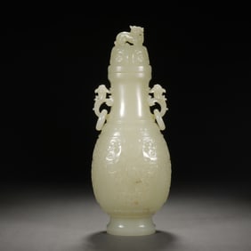 A CARVED WHITE JADE VASE WITH COVER