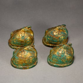 A RARE SET OF FOUR BRONZE-GILT WEIGHTS