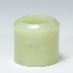 A WHITE JADE ARCHER RING