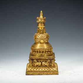 A BRONZE-GILT STUPA