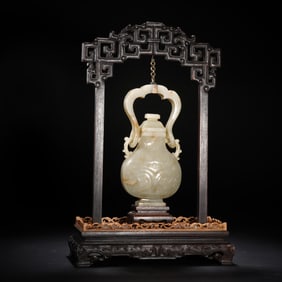 A CARVED JADE VASE WITH COVER