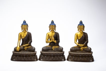 A SET OF THREE BRONZE TRINITY BUDDHAS