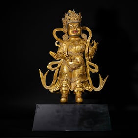 AN IMPORTANT BRONZE-GILT STANDING GUARDIAN KING DENSATIL STYLE