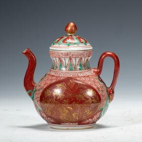 A POLYCHROME PAINTED TEAPOT