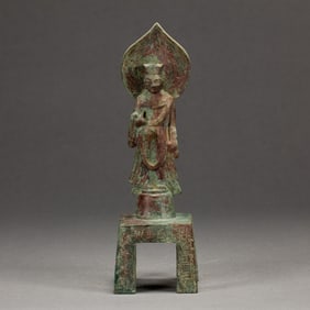 A BRONZE STANDING BUDDHA