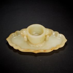 A CARVED YELLOW JADE CUP WITH STAND