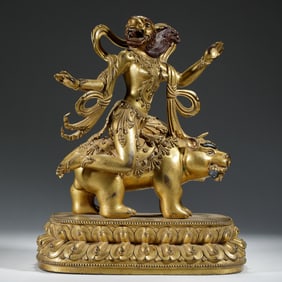 A BRONZE-GILT FIGURE OF PROTECTOR