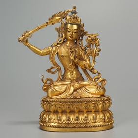 A BRONZE-GILT FIGURE OF MANJUSRI
