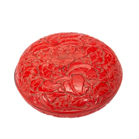 A CARVED CINNABAR LACQUER BOX WITH COVER