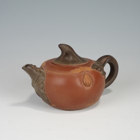 A YIXING GLAZE ZISHA TEAPOT