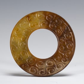 AN ARCHAISTIC JADE DISC BI